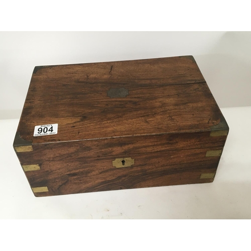 904 - A late Victorian brass bound walnut writing box with a fitted interior.