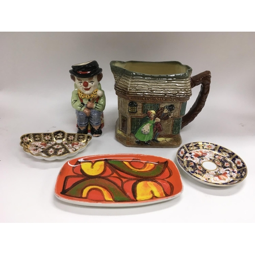 111 - A Poole dish, two small Crown Derby dishes, Doulton jug and 'The Clown' Toby jug (5). NO RESERVE