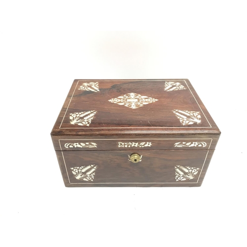 112 - An antique travelling vanity box with silver plate lids.