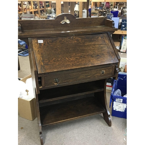 159 - No Reserve - An Oak Arts and crafts style bureau with a fall front fitted interior above a drawer an... 