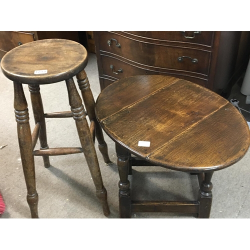 161 - No Reserve - A small oak drop leaf table on turned legs and a beechwood stool.