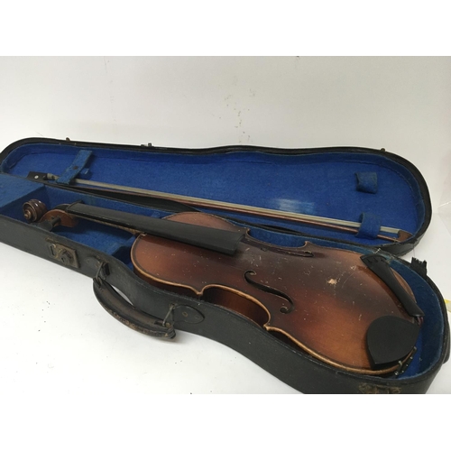 165 - A 3/4 size violin in a fitted case with bow for restoration with applied Antoninus Stradivarius labe... 