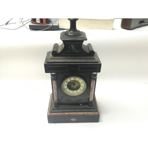 189 - A Victorian slate mantle clock in need of restoration.