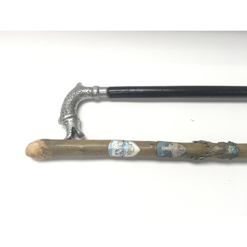 191 - Two vintage walking sticks including one with fish shaped handle.