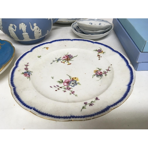 21 - Two late 18th century or early 19th century Sevres porcelain plates one damaged an 18th Century delf... 