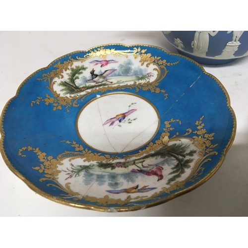 21 - Two late 18th century or early 19th century Sevres porcelain plates one damaged an 18th Century delf... 