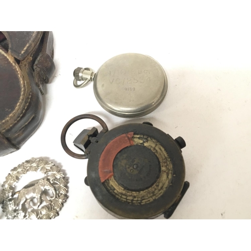 23 - A military compass maker Baker & Son London a military pedometer and a quantity of buttons and badge... 