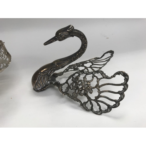 288 - A Hallmarked silver pierced dish together with a sterling silver swan head cover.