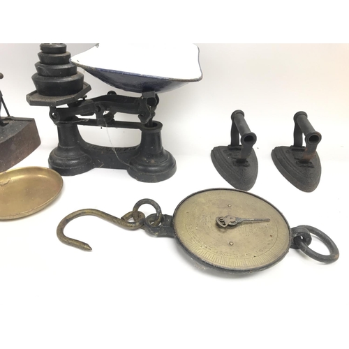 354 - Collection of vintage irons and scales.