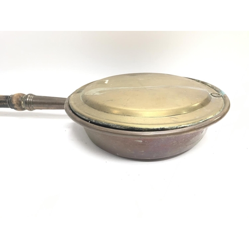 355 - A large vintage bed warming pan.