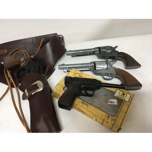 37 - Four Replica toy guns one in a leather holster. (4)