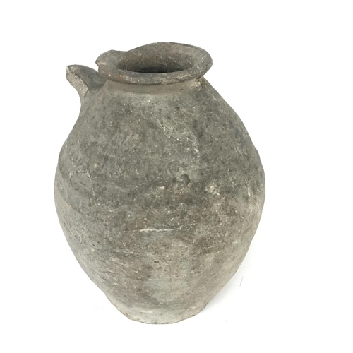 384 - A small early pottery amphora, 14cm.