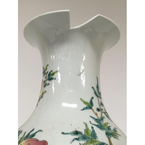 405 - A large Chinese porcelain vase with flared rim and Cantonese decoration. 41cm. Damage.