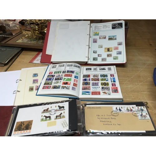 424 - A collection of Stamp albums consisting of stamps from a variety of regions and countries +first day... 