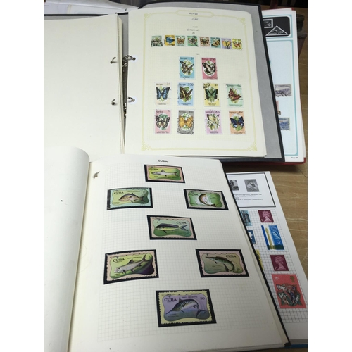 424 - A collection of Stamp albums consisting of stamps from a variety of regions and countries +first day... 