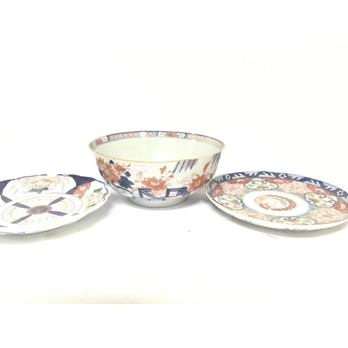 45 - A Chinese 18th export porcelain century bowl and two Imari plate. Restoration and damage. NO RESERVE