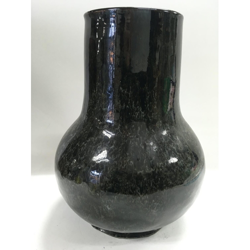 455 - A Chinese drip glaze bulbous vase in mottled colours. 25cm in height. Chips to base NO RESERVE