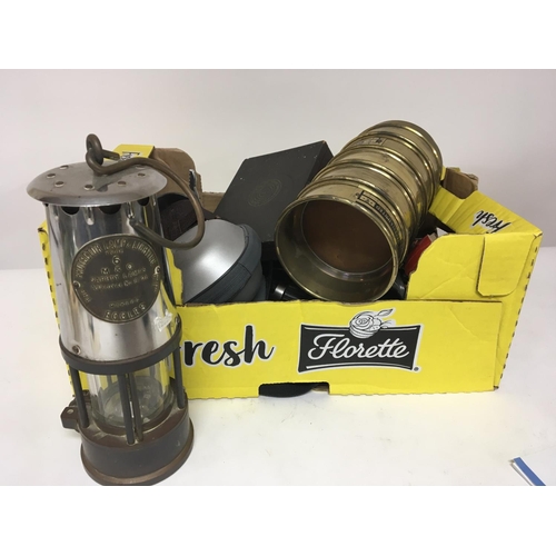 5 - A box containing camera equipment other oddments and a miners safety lamp. Postage Category C.   NO ... 