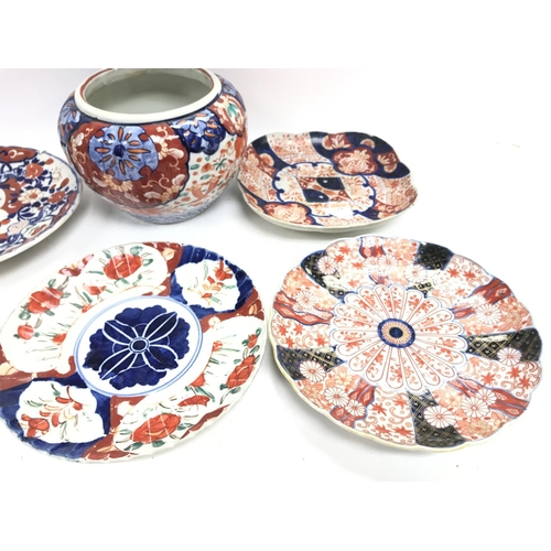 538 - A collection of Kate 19th century Imari plates and a vase.