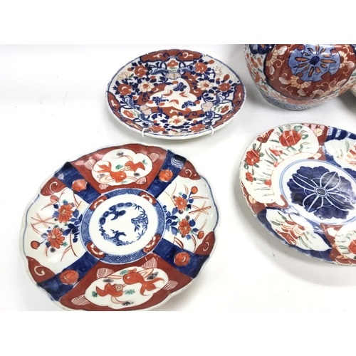 538 - A collection of Kate 19th century Imari plates and a vase.