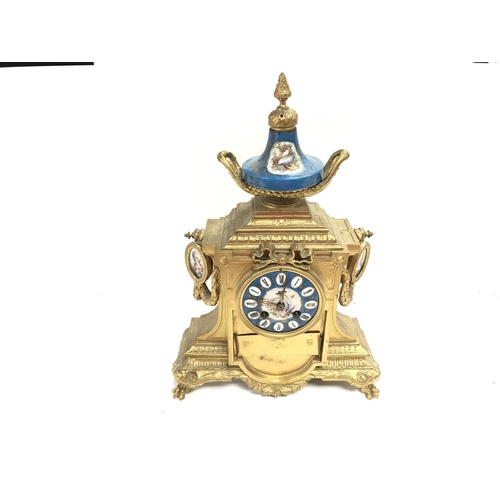 543 - A French gilt and porcelain mantel clock. No reserve.