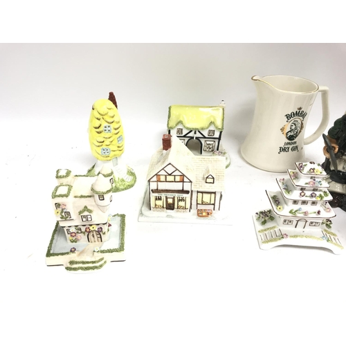 571 - A collection of ceramics including Coalport items and various Toby jugs.