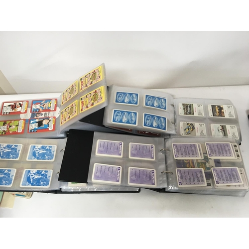 6 - A collection of four albums containing mixed playing cards and vintage collectors cards postage Cate... 