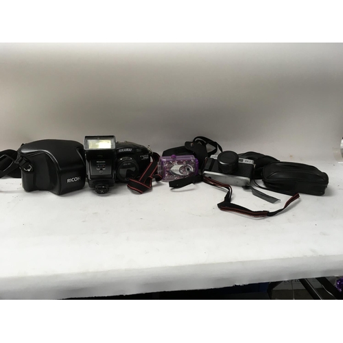 773 - A collection of cameras with cases and lense, Ricoh KR-10 super with case.