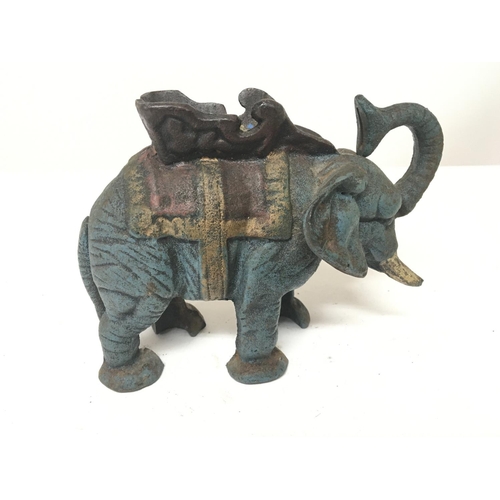 86 - No Reserve - A reproduction cast iron painted money box in the form of an elephant.