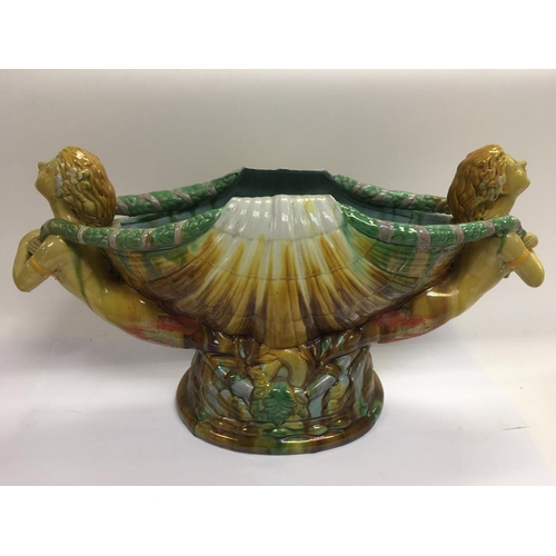 90 - A Majolica style centrepiece in the form of a large shell with a mermaid at either end together with... 