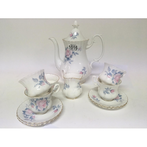 95 - A Royal Albert Porcelain coffee service decorated with flowers. Four cups and saucers no obvious dam... 