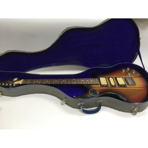 996 - A cased Givson GS1000 electric guitar.