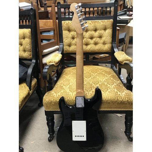 997 - Fender squire Stratocaster electric guitar in a black finish with a soft case