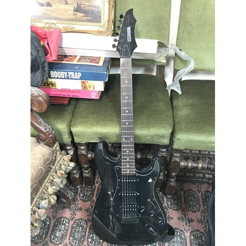 998 - Rocket special Stratocaster copy electric guitar with a black finish and hardware. Comes with a stra... 