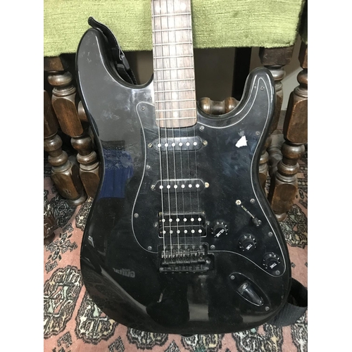 998 - Rocket special Stratocaster copy electric guitar with a black finish and hardware. Comes with a stra... 