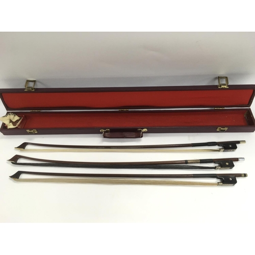 999 - Three Cello bows in a case.