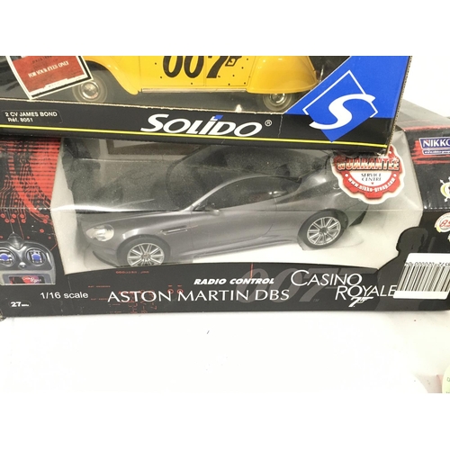 112 - 4 Boxed Die-Cast James Bond Vehicles 1:18 scale. and A Radio Controlled Aston Martin DBS.1:16 Scale