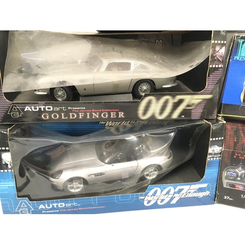 112 - 4 Boxed Die-Cast James Bond Vehicles 1:18 scale. and A Radio Controlled Aston Martin DBS.1:16 Scale