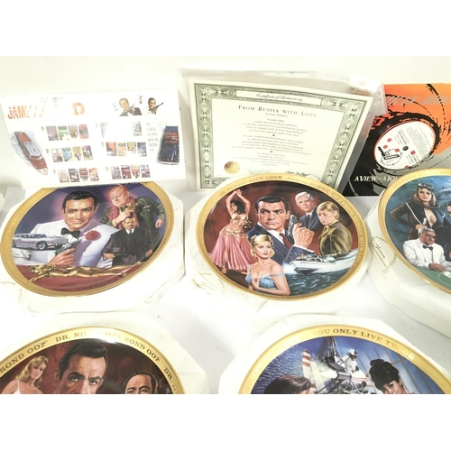 113 - A Collection of 6 Franklin Mint James Bond Collectors Plates. Playing Cards A Zippo Lighter etc.