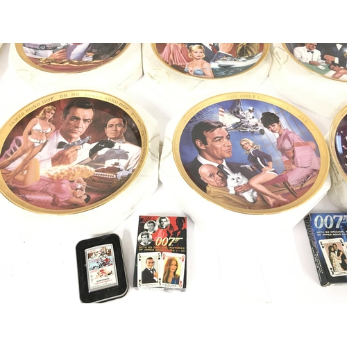 113 - A Collection of 6 Franklin Mint James Bond Collectors Plates. Playing Cards A Zippo Lighter etc.