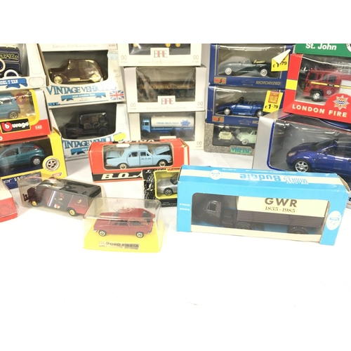 142 - A Collection of Various Boxed Die-Cast. Including Burago. EFE. Ertl.Maisto. Etc.