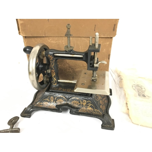 181 - A vintage Muller Childs Sewing Machine with Box And Paperwork. #15.