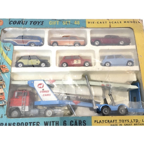 31 - A Boxed Corgi Gift Set #48. Car Transporter with 6 Cars. Box Is Worn.Plastic front is Damaged.