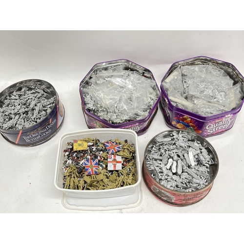 322 - 5 Tubs Containing Miniature Lead Soldiers and some plastic also.