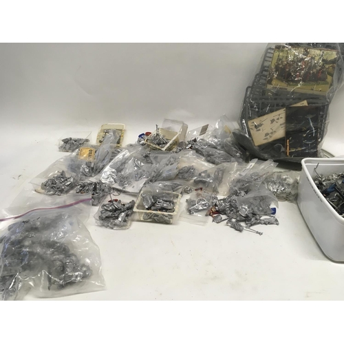 327 - Large collection of lead soldiers and parts, many unpainted. Collection includes a bag of games work... 