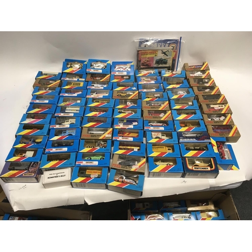 346 - A Collection of display boxed matchbox model cars, including some catalogues. (2)