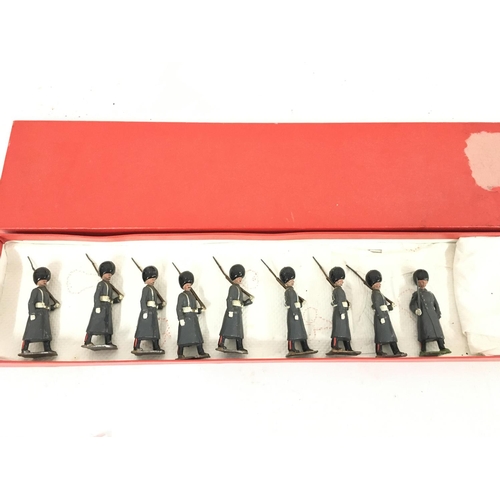 375 - A Britains set #312 Grenadier Guards in Winter Overcoats. In repro Box.