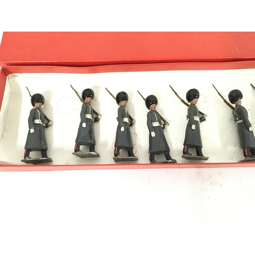 375 - A Britains set #312 Grenadier Guards in Winter Overcoats. In repro Box.