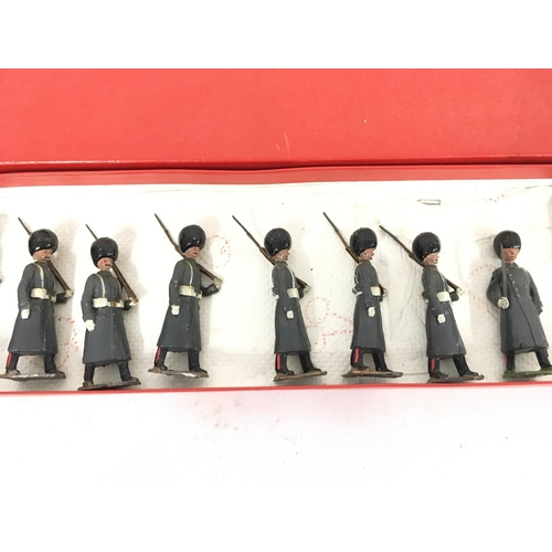 375 - A Britains set #312 Grenadier Guards in Winter Overcoats. In repro Box.