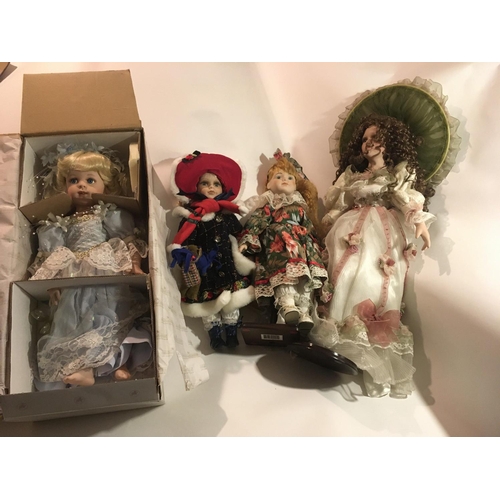 382 - A collection of four Collectable porcelain dolls.